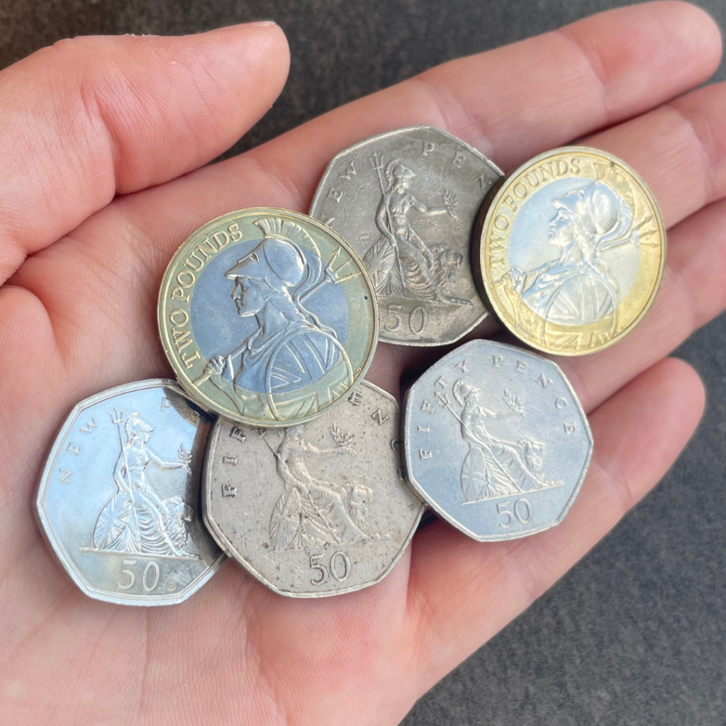 A collection of UK coins featuring Britannia