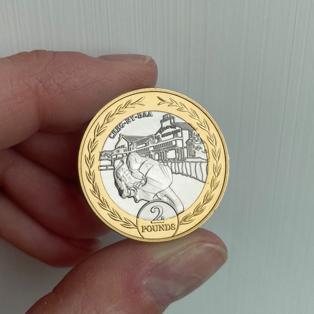 Reverse of the 2024 Isle of Man £2 in hand